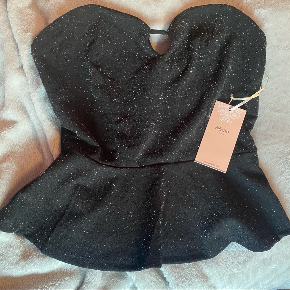Size small or medium avaliable black shirt with silver sparkles NWT